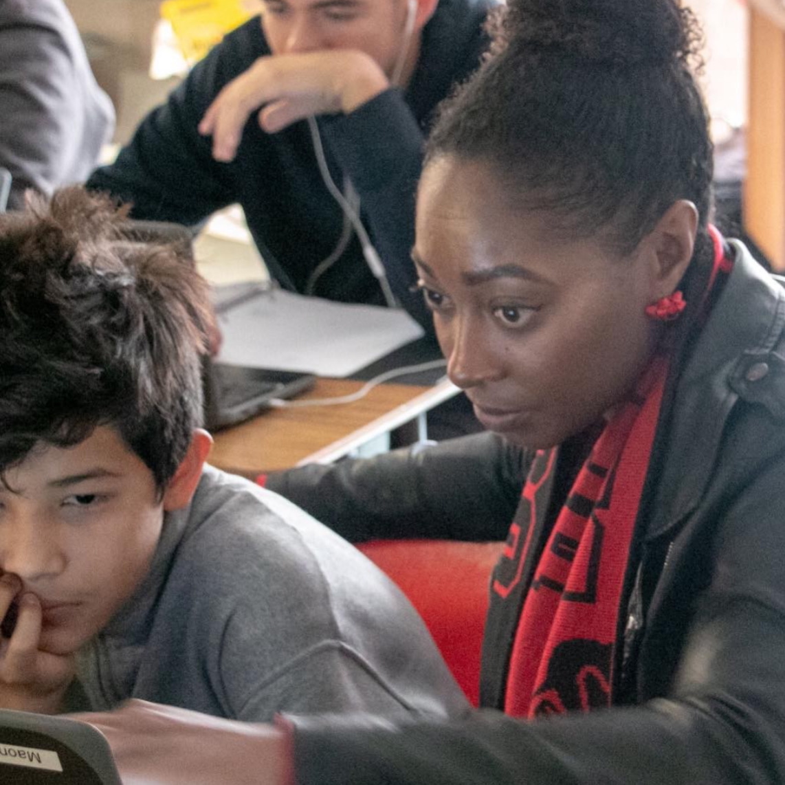 Alexandra Williams working one-on-one with a student